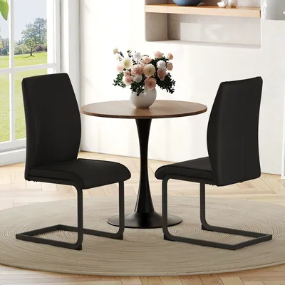 Immagine prodotto di Set di due sedie da pranzo in ecopelle, con gambe in metallo nero e design ergonomico