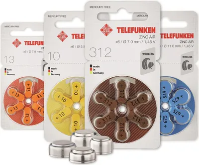 Several packages of Telefunken hearing aid batteries are displayed in a row, with some loose batteries in the foreground.