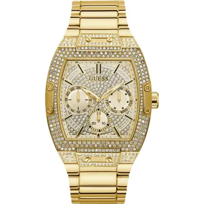 A close-up studio shot of a gold Guess watch.