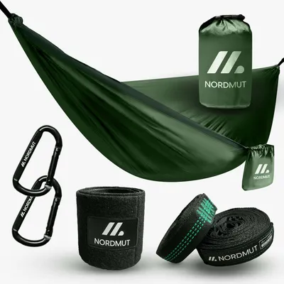 A dark green hammock and its accessories are laid out on a white background.