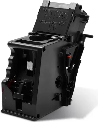 A close-up, angled view of a black coffee machine brewing unit.