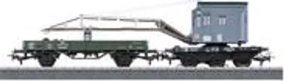 A model train set featuring a crane car and a flatbed car.