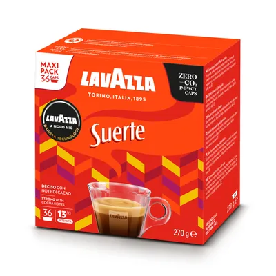 A box of Lavazza Suerte coffee capsules with a cup of coffee in front of it.