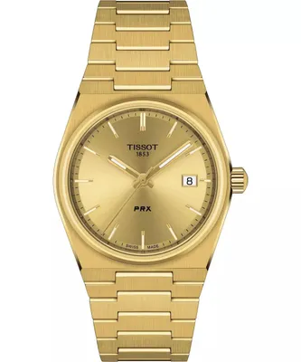 A close-up, front-facing studio shot of a gold Tissot PRX watch against a white background.