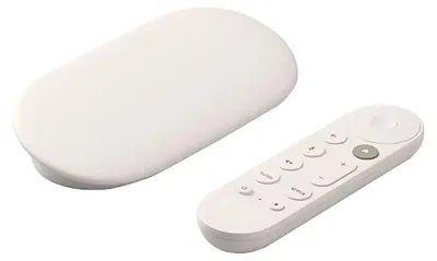 A white Google TV streamer and its remote are displayed on a white background.
