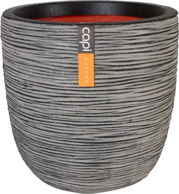 A close-up studio shot of a textured planter pot with a label.