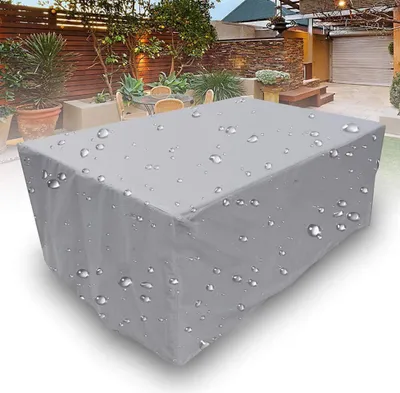 A gray rectangular cover for outdoor furniture, with water droplets on its surface, placed on a white background.