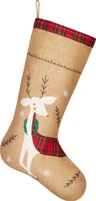 A Christmas stocking with a reindeer design on a white background.