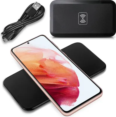 A smartphone and wireless charger are displayed on a white background.