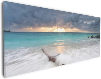Produktbild von Wallario Premium Leinwandbild Wellen am Strand bei Sonnenuntergang in Größe 30 x 75 cm
