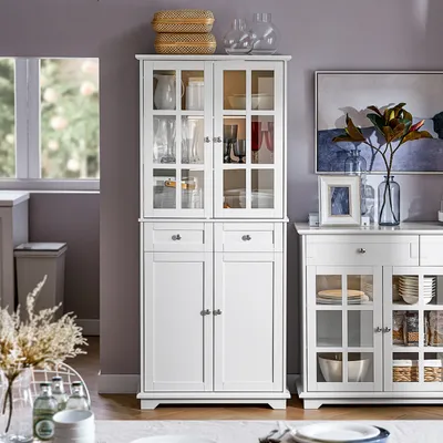 A white buffet cabinet with glass doors is shown in a room with purple walls.