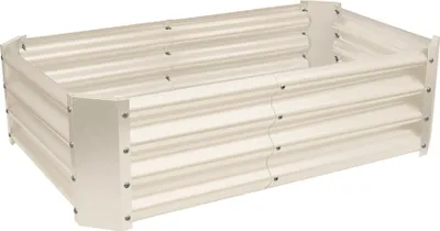 A rectangular raised garden bed made of corrugated metal.