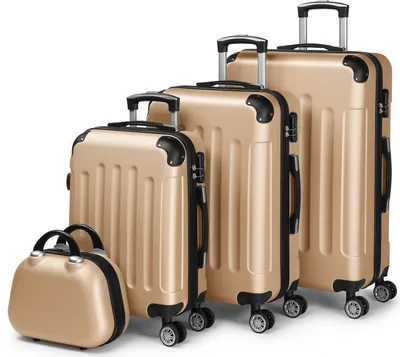 A set of four gold-colored suitcases of varying sizes, including a small beauty case, are arranged in a line against a white background.