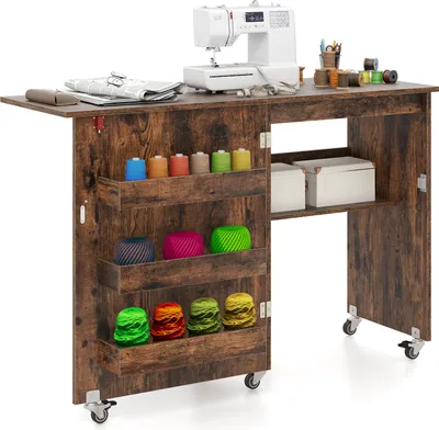 A sewing table with a sewing machine and various sewing supplies.