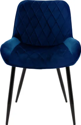 A dark blue velvet dining chair with diamond quilting on the back and seat, supported by four black metal legs.