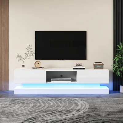 Imagen del producto de Mueble de TV de 160x35x40,5 cm, fabricado en tablero de partículas, color blanco, con frentes de cajones de alto brillo y zócalo, con iluminación LED, y 2 cajones