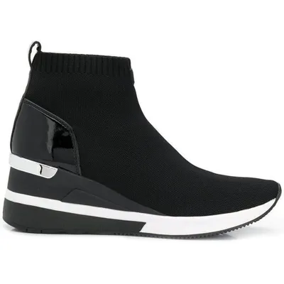 A black sock sneaker with a wedge heel and silver and white accents.