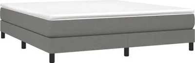 A mattress base with a white mattress on top, supported by black legs.