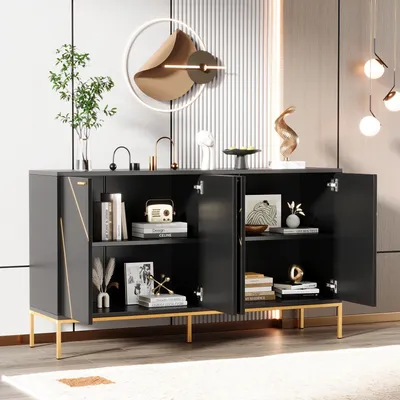 A modern black sideboard with gold accents, featuring open doors revealing shelves with decorative items and books, set in a well-lit room.