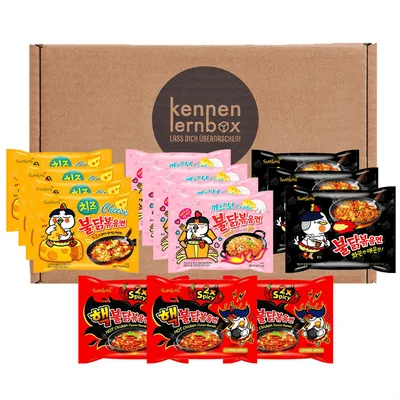 A box containing multiple packs of Buldak ramen noodles in various flavors.
