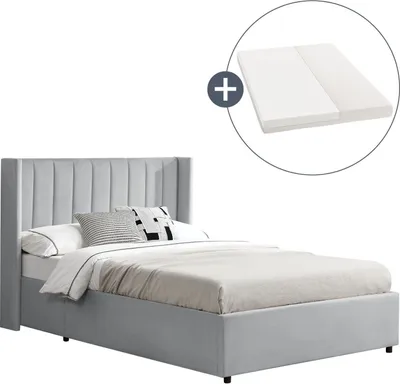 A bed with a mattress and pillows, shown on a white background. An inset circle shows a mattress.