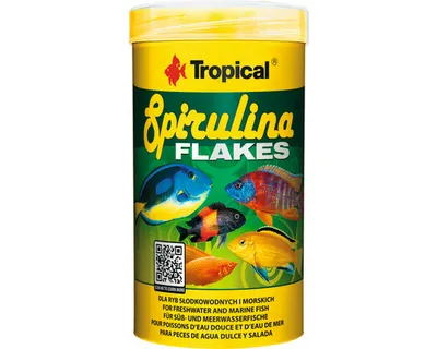 A cylindrical container of fish food with images of fish on it.