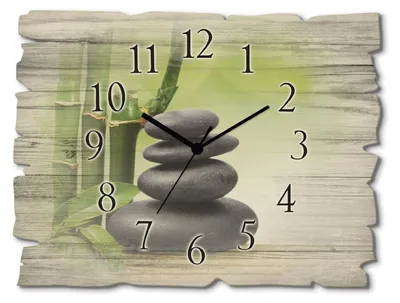 A clock with a zen-themed image of stacked stones and bamboo.