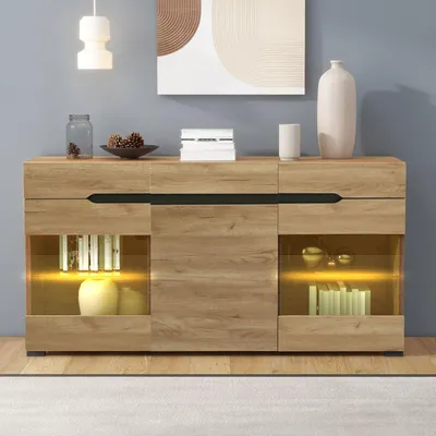 A modern wooden sideboard with glass doors and internal LED lighting, displaying decorative items and books.