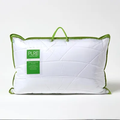 A white pillow in its packaging with a green trim and handle, against a white background.