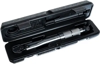 A torque wrench in its black storage case, against a white background.