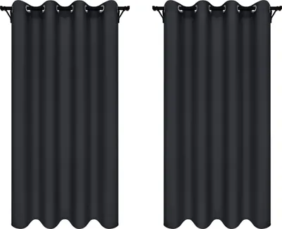 Two dark gray curtains hanging on curtain rods against a white background.