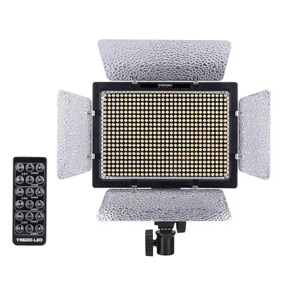 A studio video light with a remote control, shown against a white background.