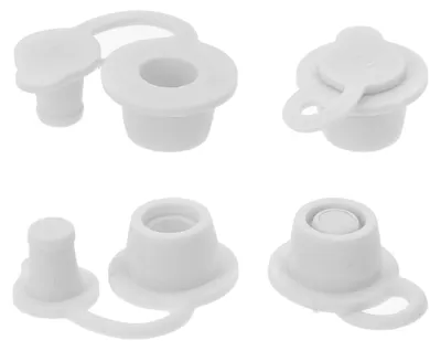 Four white plastic caps with attached lids, arranged in a two-by-two grid against a white background.