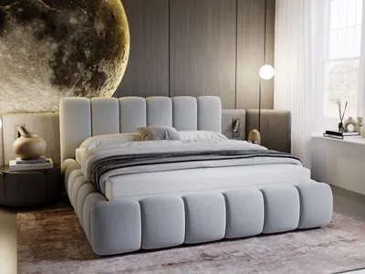 A modern bedroom with a large bed, moon-themed wall art, and a window.