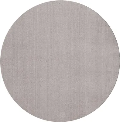 A circular rug with a subtle vertical texture.