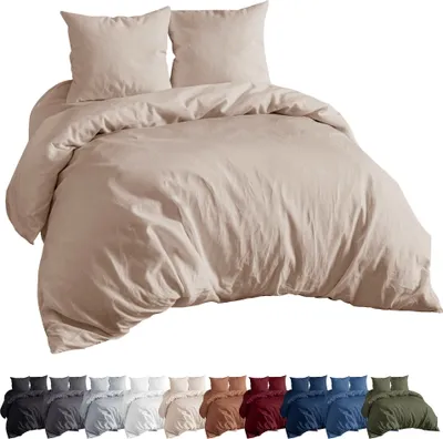 A taupe colored duvet cover and pillow set is displayed against a white background. Below the main product image, a row of smaller images shows the same bedding set in various colors.