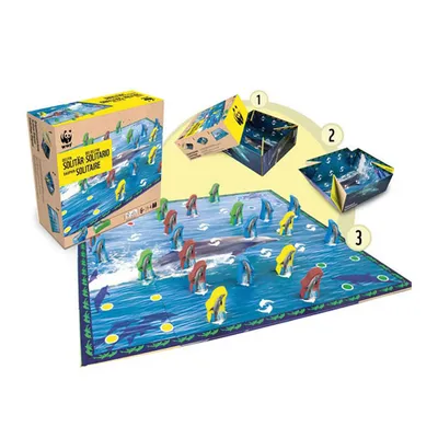 A WWF Solitär board game with dolphin-shaped pieces and a game board depicting a marine environment. The image also shows the product packaging and instructional diagrams.
