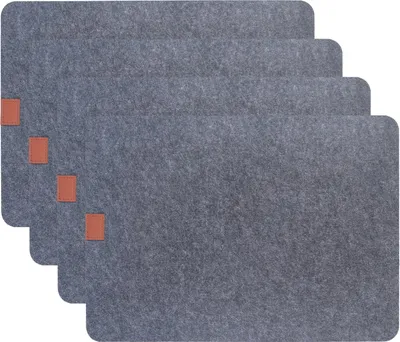 A stack of four grey placemats with small brown accents.