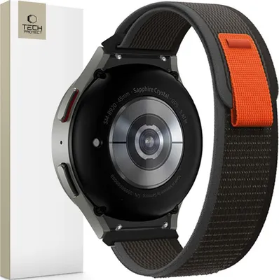 The back of a smartwatch with a nylon band, next to its packaging.