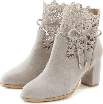 A pair of light gray lace-trimmed ankle boots with block heels, presented against a white background.