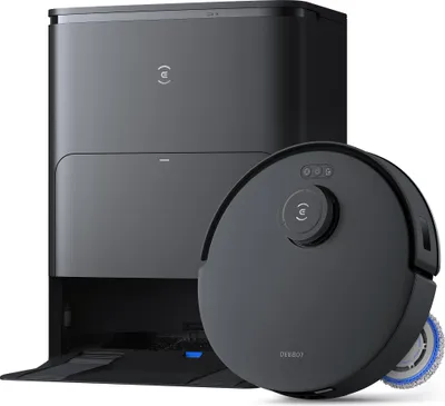 A black robot vacuum cleaner and its charging station are shown against a white background.