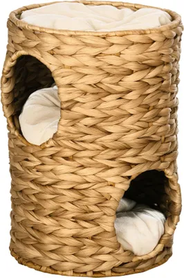 A woven cat tree with two openings and cushions inside, presented against a white background.