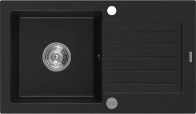 A top-down view of a black granite kitchen sink with a single basin and a drainboard.