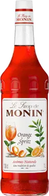A bottle of Monin Orange Spritz syrup.