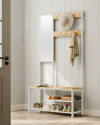 A hallway or entryway with a coat rack, shoe rack, and mirror.
