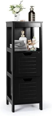 A black wooden bathroom cabinet with two drawers and open shelving, decorated with toiletries and flowers.