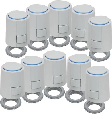 A group of white thermostatic radiator valves arranged in two rows on a white background.