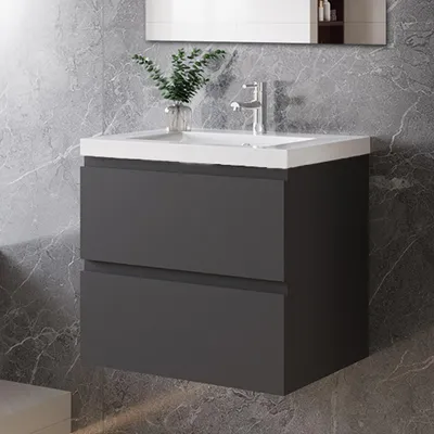 A modern bathroom vanity with a sink and faucet.