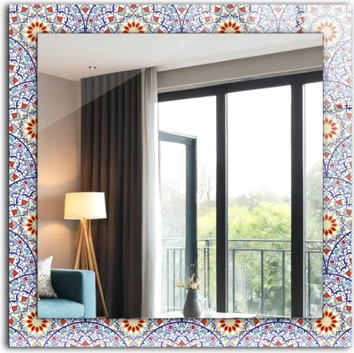 A decorative mirror with a mandala pattern border, reflecting a room with a window and curtains.