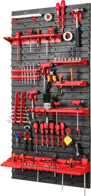 A wall-mounted tool organizer with various tools displayed.